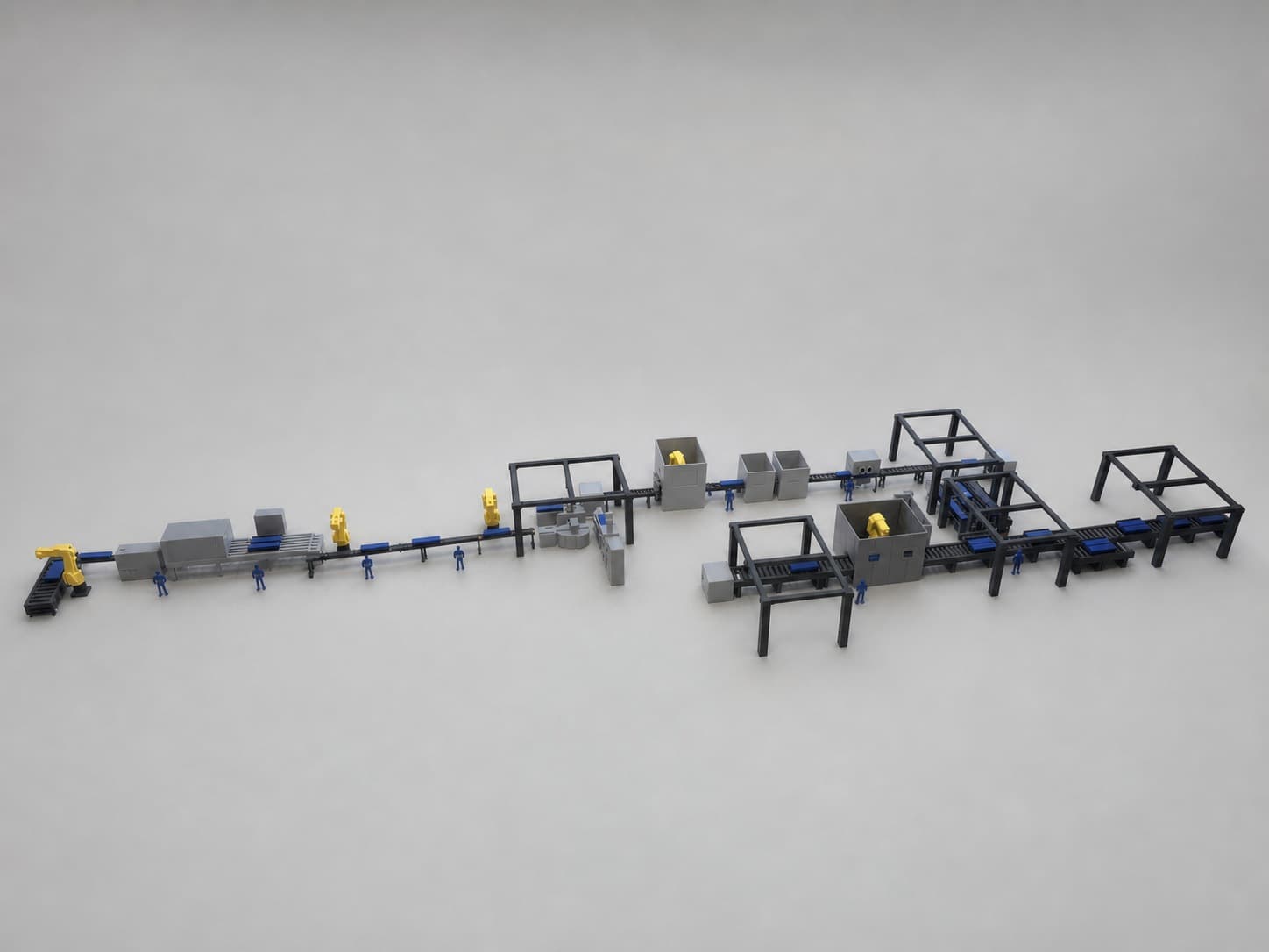 Wide view of the factory production-line scale model with conveyors, robot cells and equipment arranged across the full layout.